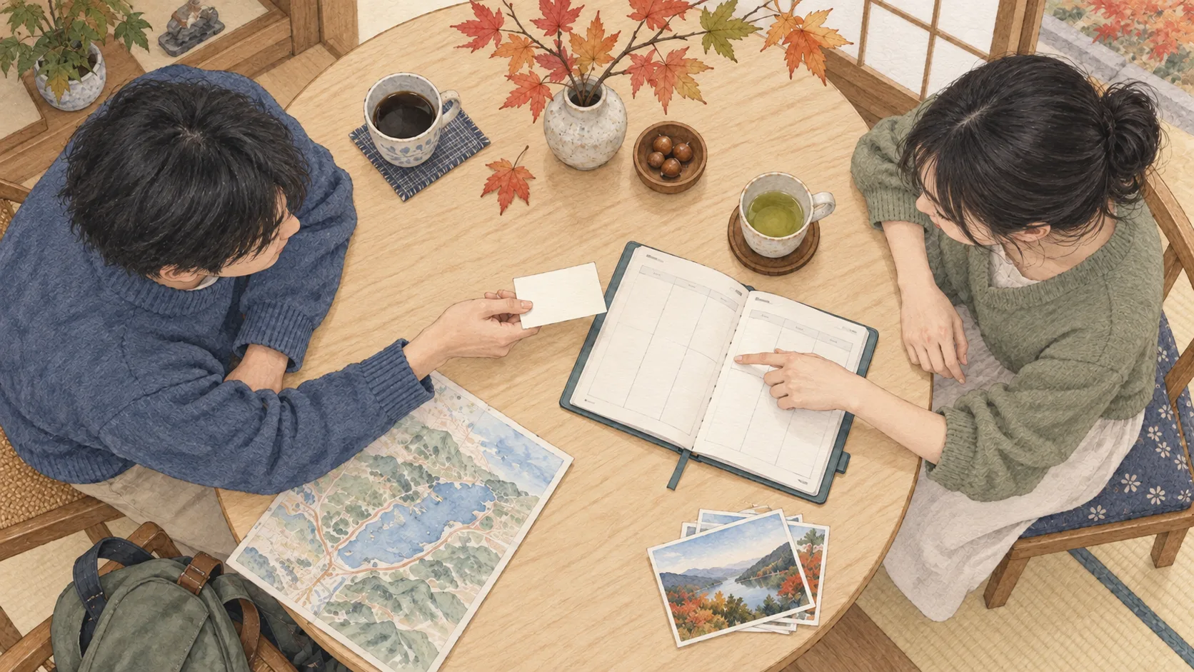 紅葉を飾った丸テーブルで、二人が手帳を開いて予定を相談する様子