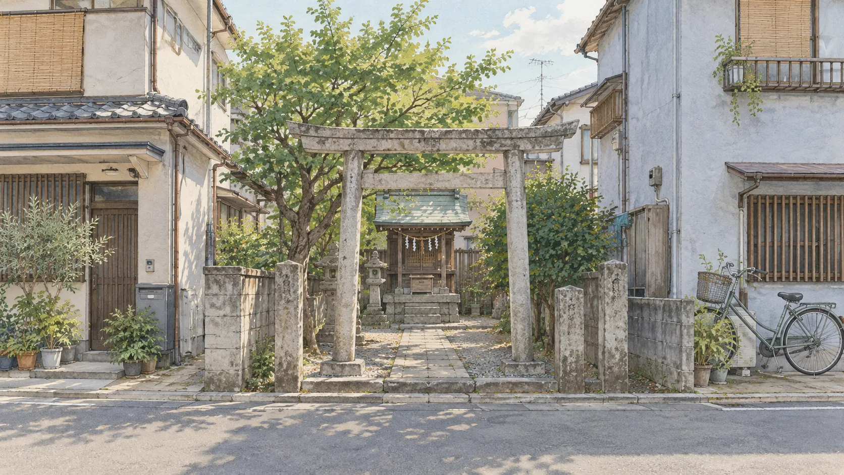 住宅の並ぶ街角にある、小さな鳥居と掃き清められた参道